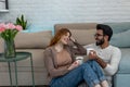 Married couple drinking coffeee, enjoying spending time together, relaxing, sweet tender moment.