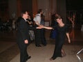 A married couple enjoy dancing at a dance hall