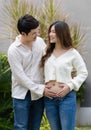 Married couple is expecting baby. man embraces his pregnant wife Royalty Free Stock Photo