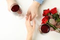 Married couple hands, wine and roses on white background