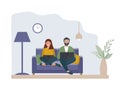 A married couple with a laptop sits at home on the sofa. Work at home, online education. Students or freelancers, bloggers