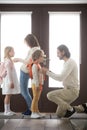 Married couple and little children standing in hallway at home Royalty Free Stock Photo