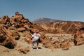 A married couple is standing in the crater of the Teide volcano. Desert landscape in Tenerife. Teide National Park Royalty Free Stock Photo