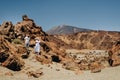 A married couple is standing in the crater of the Teide volcano. Desert landscape in Tenerife. Teide National Park Royalty Free Stock Photo