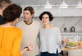 Smiling married couple welcoming guests for diner party at home Royalty Free Stock Photo