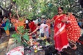 Married Hindu ladies worship a holy tree and Shiva lingam