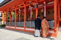 Japanese couple praying at the temple