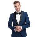 Married man in blue suit adjusting his sleeve Royalty Free Stock Photo