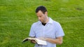 Married man reading with his hand on the Bible. Royalty Free Stock Photo