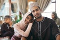 Married muslim couple together with family celebrating islamic religious holiday event wishing an eid mubarak or ramadan