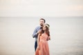 Married wedding couple standing on a wharf over the sea Royalty Free Stock Photo