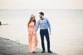 Married wedding couple standing on a wharf over the sea Royalty Free Stock Photo