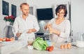 Marrieds cooking together Royalty Free Stock Photo