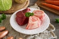 Marrow bones, beef meat and fresh vegetables for preparing homemade bone broth Royalty Free Stock Photo