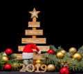 Marry Christmas and happy New Year 2019 layout. The black background is decorated with numbers 2019, Christmas toys and a Christma