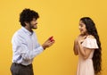 Marry me concept. Happy indian man proposing showing engagement ring box and asking girlfriend to be his wife Royalty Free Stock Photo