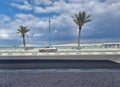 Marsa Matrouh, Egypt, September 2, 2023, a car moving on the coastal road with palm trees near Rommel Beach