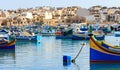 Marsaxlokk fishermen village in Malta. Traditional colorful boats at the port of Marsaxlokk Royalty Free Stock Photo