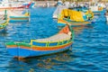 Marsaxlokk with Luzzu, traditional fishing boat from Malta islands Royalty Free Stock Photo