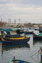 Marsaxlokk, Malta, August 2015. Multicolored traditional maltese fishing boats in the bay.