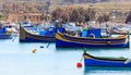 Marsaxlokk fishermen village in Malta. Traditional colorful boats at the port of Marsaxlokk Royalty Free Stock Photo