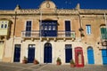 MARSAXLOKK, MALTA - 03 JAN, 2020: Classic red British telephone box at the traditional fishing village of Marsaxlokk Royalty Free Stock Photo