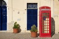 MARSAXLOKK, MALTA - 03 JAN, 2020: Classic red British telephone box at the traditional fishing village of Marsaxlokk Royalty Free Stock Photo