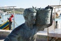 MARSAXLOKK, MALTA - JAN 02sn, 2020: Fisher mam sculpture at Marsaxlokk fish market is a very popular attraction outdoor Royalty Free Stock Photo