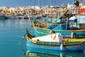 Marsaxlokk, Malta - January 10, 2020: Traditional fishing boats in the Mediterranean Village of Marsaxlokk, Malta Royalty Free Stock Photo