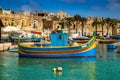 Marsaxlokk, Malta - Traditional colorful maltese Luzzu fisherboat at the old village of Marsaxlokk