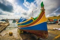 Marsaxlokk, Malta - Traditional Luzzu fisherboat at the famous market of Marsaxlokk