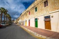 Marsaxlokk, Malta - Traditional maltese vintage house with orange, blue, yellow, red, green and brown doors and windows Royalty Free Stock Photo