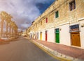 Marsaxlokk, Malta - Traditional maltese vintage house with orange, blue, yellow, red, green and brown doors