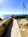 Marsaxlokk, Malta - 10-24-22 - Winding stone wall and walking path along the ocean