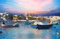 Marsaxlokk village harbor of Malta with boats on sea