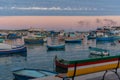 Traditional eyed colorful boats Luzzu in the Harbor of Mediterranean fishing village Marsaxlokk, Malta Royalty Free Stock Photo