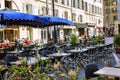 Marseille, France, 08/10/2019: Alley with tables in urban European cafes