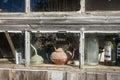 Still life with objects behind a dusty window