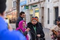 Senior Arab lady singing in a band of street musicians peforming in Marseilles, France