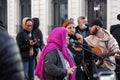 Senior Arab lady singing in a band of street musicians peforming in Marseilles, France