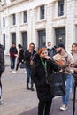 Senior Arab lady singing in a band of street musicians peforming in Marseilles, France