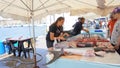 Marseille, France - May 29, 2023: French fisherman selling fresh fish at Vieux Port in Marseille, France.