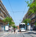 Marseille, France - May 15th 2022: Tramstop with a modern streetcar surrounded by historic housing blocks