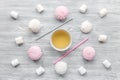 Marsh-mallow and tea for woman breakfast concept on wooden background top view Royalty Free Stock Photo