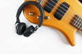 Marshall bluetooth headphones, wireless, and bass guitar on white background