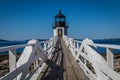 Marshall Point Lighthouse and walkway against a bright blue sky Royalty Free Stock Photo