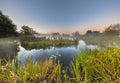 Marshland river system under foggy morning sunrise Royalty Free Stock Photo