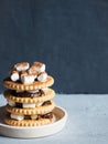 Marshmallow brownies with chocolate on the cookies in layers on textured grey concrete background. Copy space.