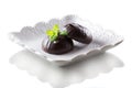 Marshmallow in chocolate and a mint leaf isolated on a white background Royalty Free Stock Photo