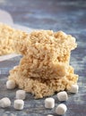 Marshmallow Crispy Rice Cereal Treat Bars on a Wooden Table Royalty Free Stock Photo